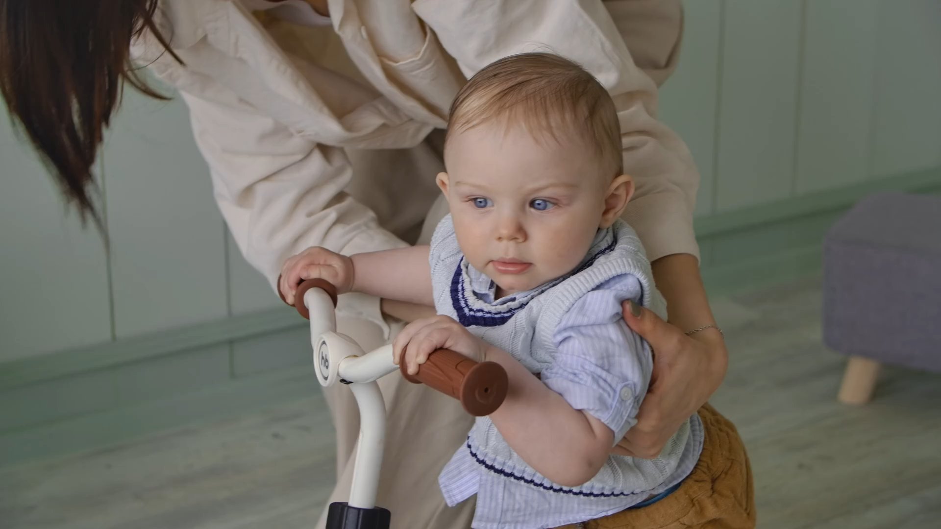 Baby taking first steps with a walker